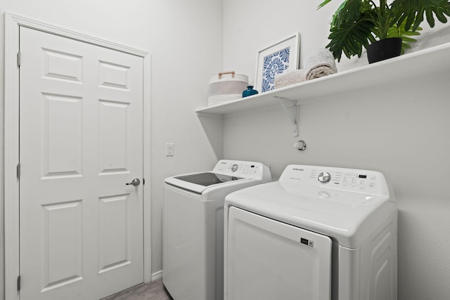 washroom with laundry area and washer and dryer