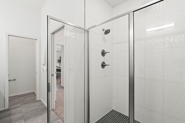 full bath featuring a shower stall
