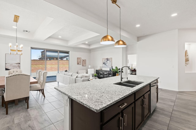 kitchen featuring an inviting chandelier, a sink, recessed lighting, stainless steel dishwasher, and visible vents