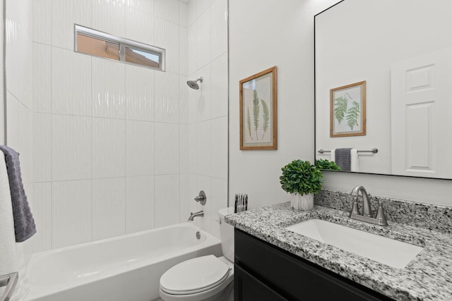 bathroom featuring vanity, bathtub / shower combination, and toilet