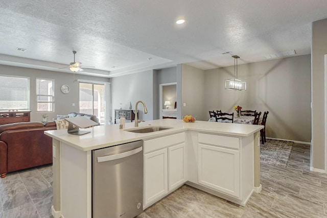 4017 Windy Rd NE, Rio Rancho, NM 87144 - kitchen featuring a textured ceiling, dishwasher, open floor plan, and a sink