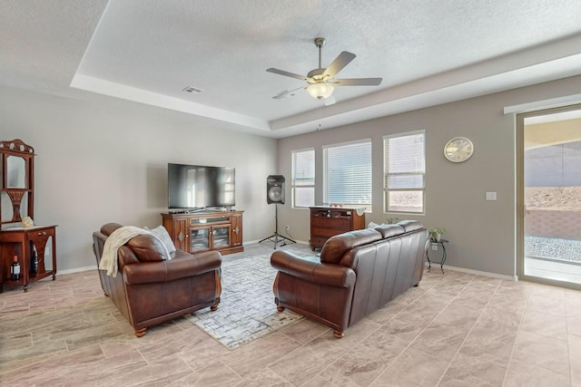 4017 Windy Rd NE, Rio Rancho, NM 87144 - living room with a textured ceiling, ceiling fan, a raised ceiling, and visible vents