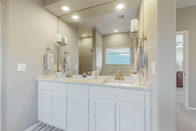 4017 Windy Rd NE, Rio Rancho, NM 87144 - full bath with double vanity, a sink, baseboards, and visible vents
