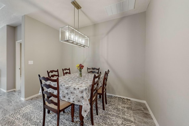 4017 Windy Rd NE, Rio Rancho, NM 87144 - dining room featuring an inviting chandelier, visible vents, and baseboards