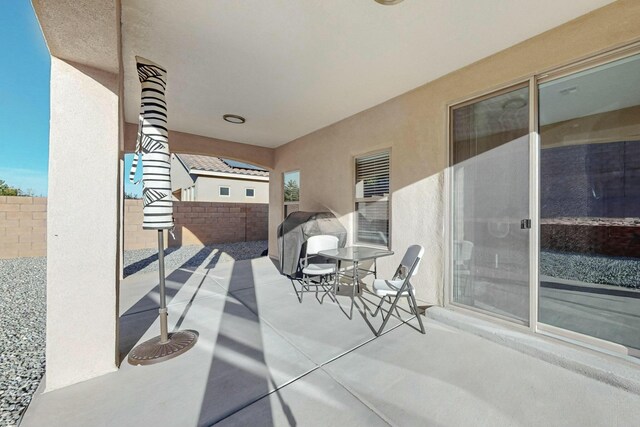 4017 Windy Rd NE, Rio Rancho, NM 87144 - view of patio / terrace with outdoor dining space and a fenced backyard