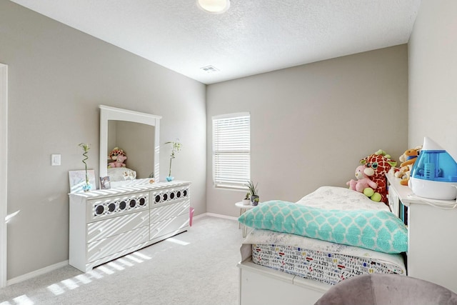 4017 Windy Rd NE, Rio Rancho, NM 87144 - bedroom featuring a textured ceiling, visible vents, carpet flooring, and baseboards