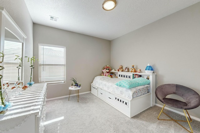 4017 Windy Rd NE, Rio Rancho, NM 87144 - carpeted bedroom featuring baseboards, visible vents, and a textured ceiling