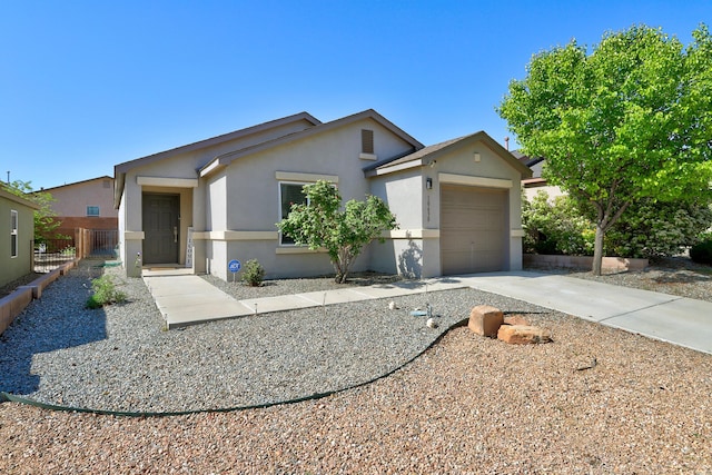 single story home with an attached garage, driveway, stucco siding, and fence