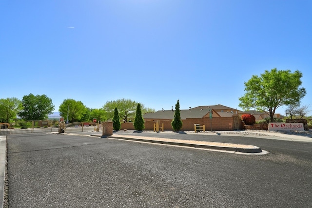 ranch-style house with fence