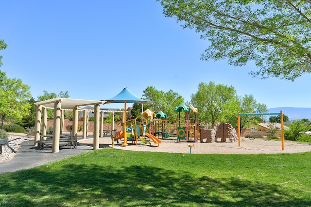 communal playground featuring a yard