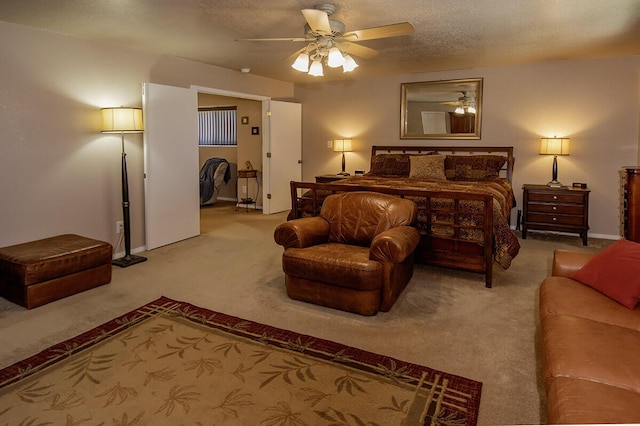 carpeted bedroom featuring a textured ceiling, ceiling fan, and baseboards