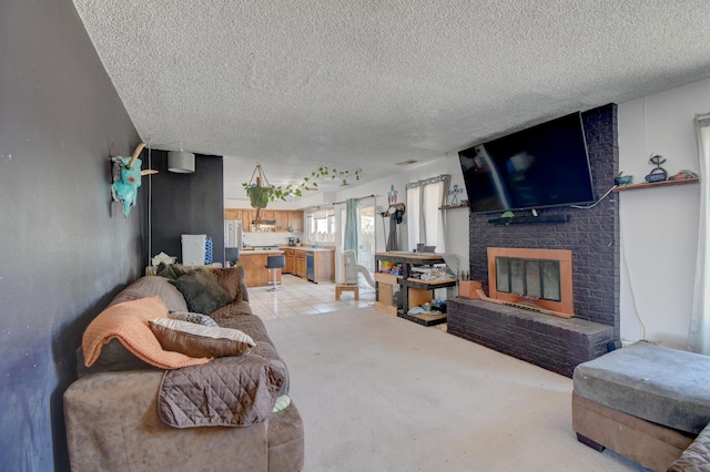 360 Knox Ct, Rio Communities, NM 87002 - living room featuring a brick fireplace and a textured ceiling