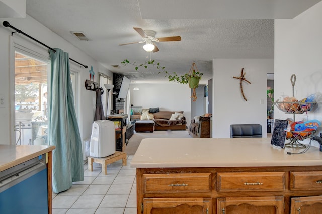 360 Knox Ct, Rio Communities, NM 87002 - kitchen featuring visible vents, light countertops, ceiling fan, and light tile patterned flooring