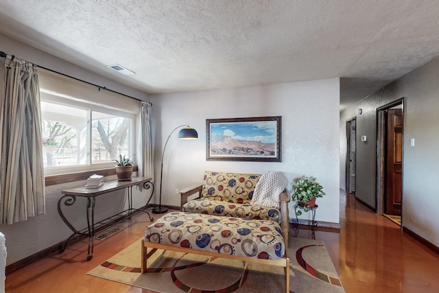 38 Elias Rd, Los Lunas, NM 87031 - living area featuring a textured ceiling and wood finished floors