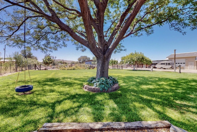 38 Elias Rd, Los Lunas, NM 87031 - view of yard featuring a garage