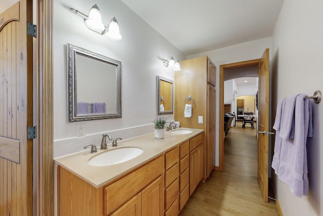 630 Barnett Rd, Bosque Farms, NM 87068 - bathroom with wood finished floors and double vanity
