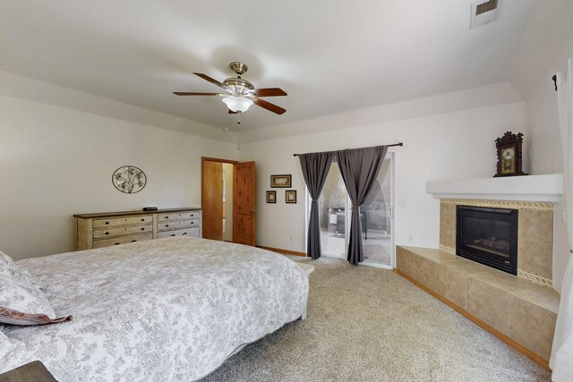 630 Barnett Rd, Bosque Farms, NM 87068 - carpeted bedroom featuring access to exterior, a tiled fireplace, ceiling fan, and baseboards