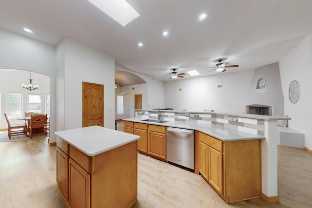 630 Barnett Rd, Bosque Farms, NM 87068 - kitchen with a large island with sink, stainless steel dishwasher, arched walkways, a sink, and open floor plan