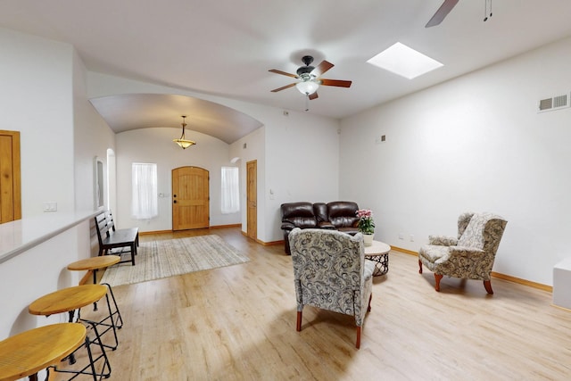 630 Barnett Rd, Bosque Farms, NM 87068 - entryway with a ceiling fan, wood finished floors, arched walkways, baseboards, and lofted ceiling