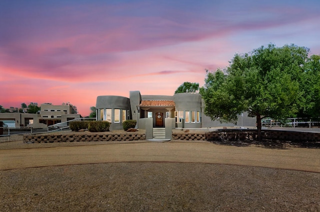 630 Barnett Rd, Bosque Farms, NM 87068 - pueblo-style house with a tile roof and stucco siding