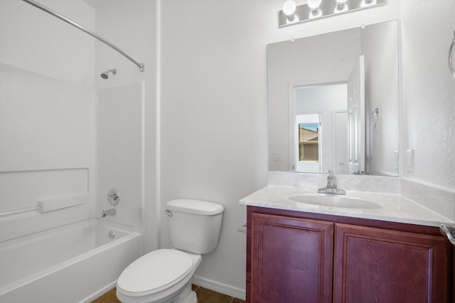bathroom with baseboards, toilet, shower / tub combination, and vanity
