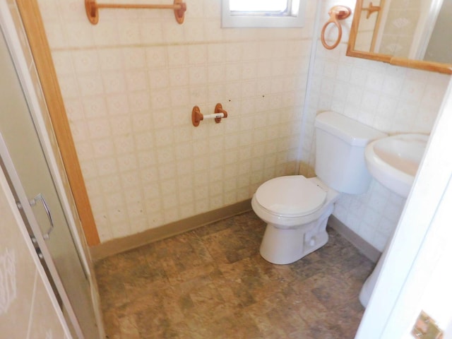 bathroom featuring toilet and tile patterned floors