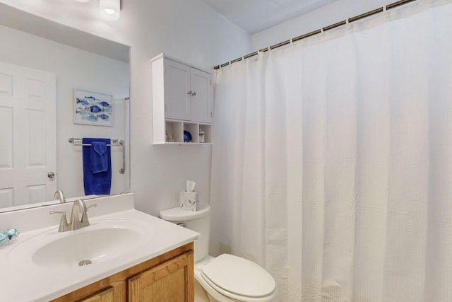full bathroom with vanity and toilet