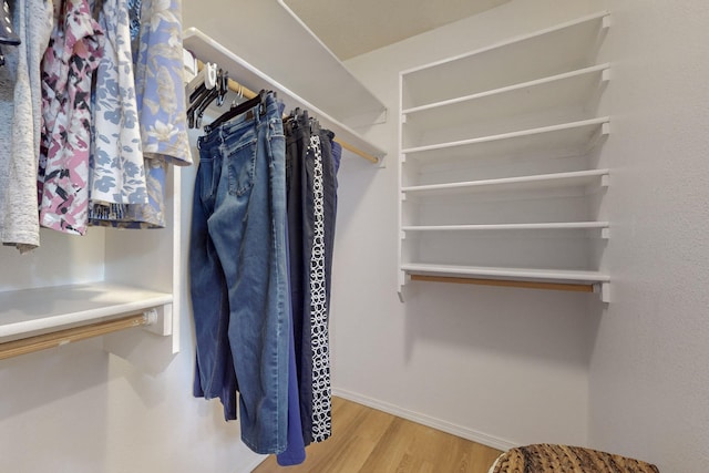 spacious closet with wood finished floors