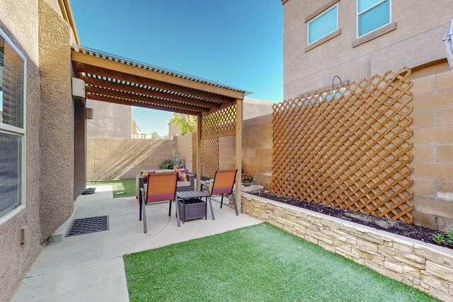 view of patio / terrace featuring a fenced backyard and a pergola