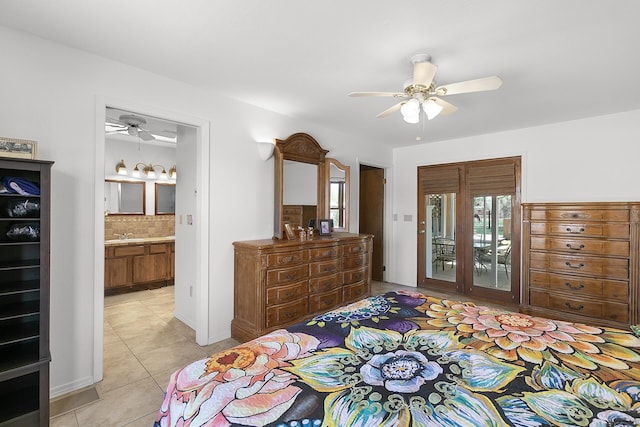7 Wildwood Ln, Peralta, NM 87042 - bedroom with light tile patterned floors, ensuite bathroom, access to exterior, and multiple windows