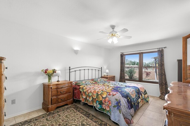 7 Wildwood Ln, Peralta, NM 87042 - bedroom with light tile patterned floors, a ceiling fan, and baseboards