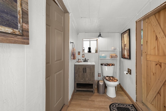 7 Wildwood Ln, Peralta, NM 87042 - bathroom with toilet, vanity, and wood finished floors