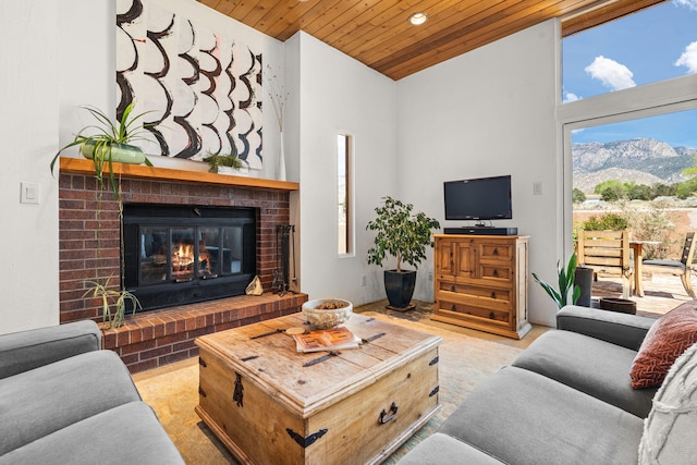 living room featuring carpet flooring, a brick fireplace, recessed lighting, a towering ceiling, and wood ceiling