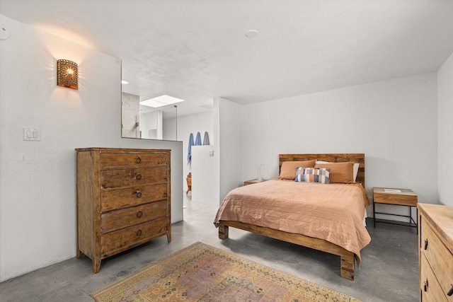 bedroom featuring concrete floors