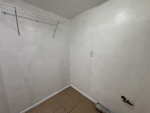 spacious closet featuring tile patterned floors