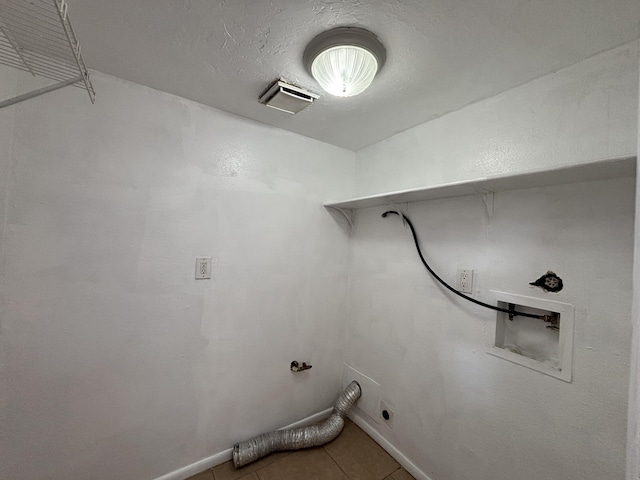 washroom featuring laundry area, electric dryer hookup, hookup for a washing machine, visible vents, and tile patterned flooring