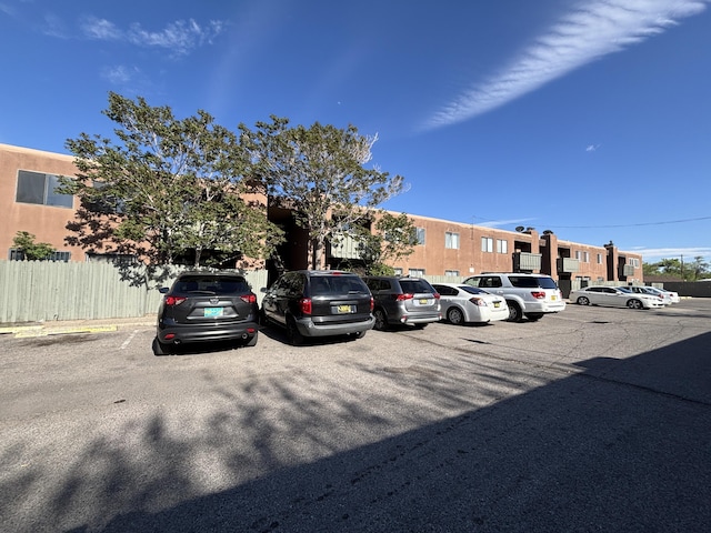 uncovered parking lot with fence