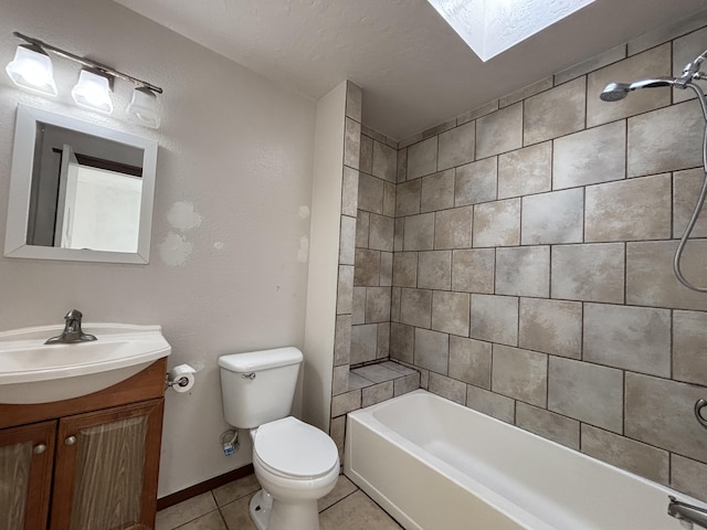 full bathroom with toilet, shower / washtub combination, vanity, tile patterned flooring, and a skylight