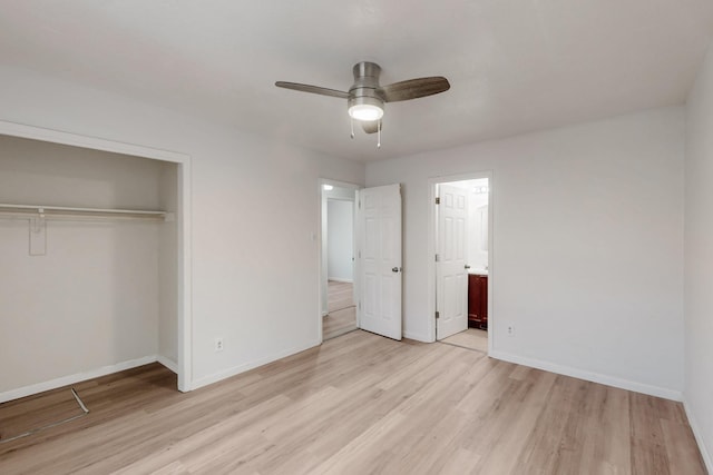 308 Garden Ave SW, Los Lunas, NM 87031 - unfurnished bedroom with a closet, baseboards, ensuite bath, and light wood-type flooring