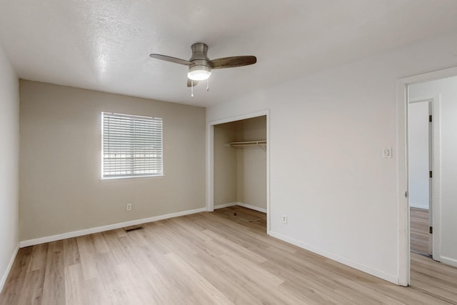 308 Garden Ave SW, Los Lunas, NM 87031 - unfurnished bedroom with visible vents, light wood finished floors, baseboards, and a closet