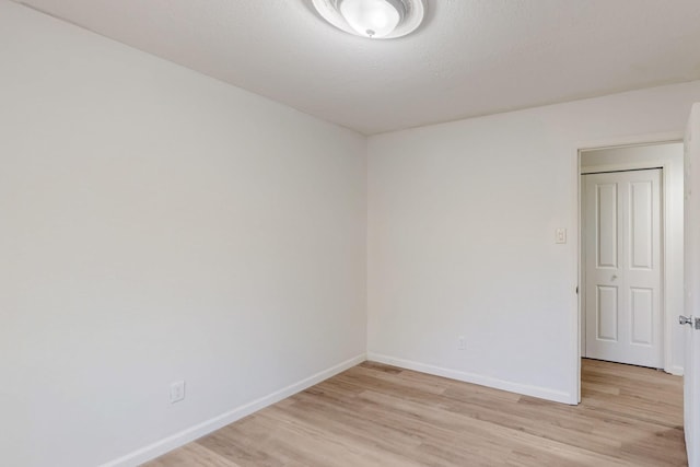 308 Garden Ave SW, Los Lunas, NM 87031 - empty room with light wood-style floors and baseboards