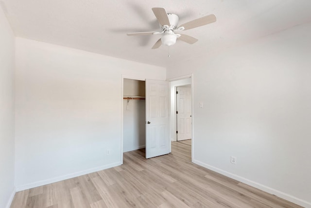 308 Garden Ave SW, Los Lunas, NM 87031 - unfurnished bedroom with a closet, baseboards, ceiling fan, and light wood-style floors