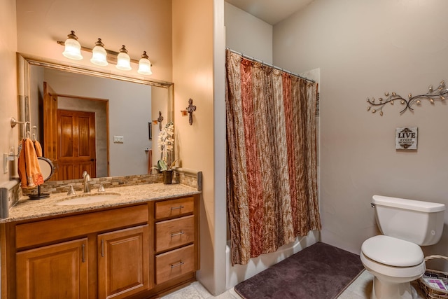 full bathroom featuring shower / tub combo, toilet, and vanity