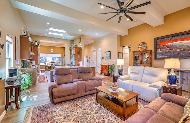 3919 Bryan Ave NW, Albuquerque, NM 87114 - living room featuring wood finished floors, a ceiling fan, and recessed lighting