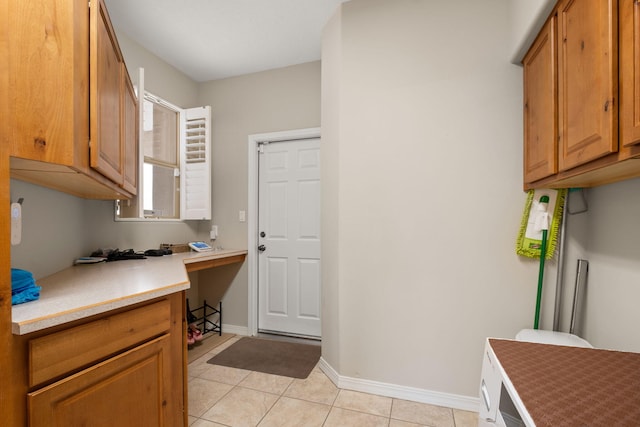 8719 Desert Fox Way NE, Albuquerque, NM 87122 - clothes washing area with light tile patterned floors and baseboards