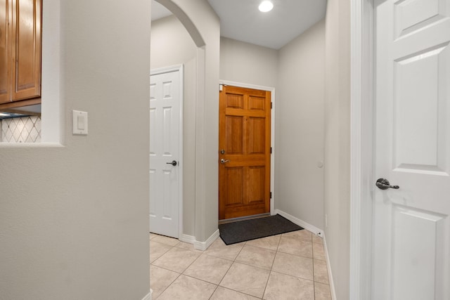 8719 Desert Fox Way NE, Albuquerque, NM 87122 - entryway with arched walkways, baseboards, recessed lighting, and light tile patterned floors