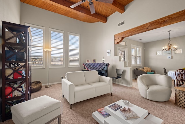 8719 Desert Fox Way NE, Albuquerque, NM 87122 - living room featuring carpet flooring, beamed ceiling, visible vents, and wood ceiling