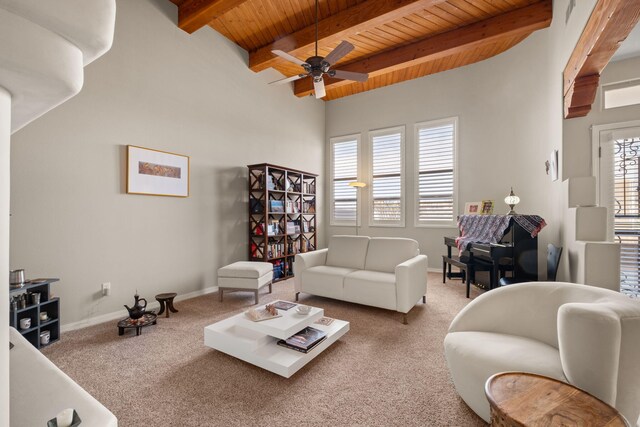8719 Desert Fox Way NE, Albuquerque, NM 87122 - carpeted living room with baseboards, wood ceiling, ceiling fan, and beam ceiling