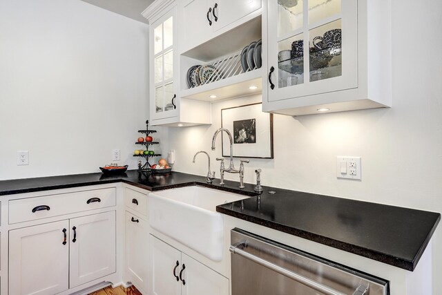 107 Rome Ln, Corrales, NM 87048 - kitchen featuring dishwasher, white cabinetry, dark countertops, and glass insert cabinets