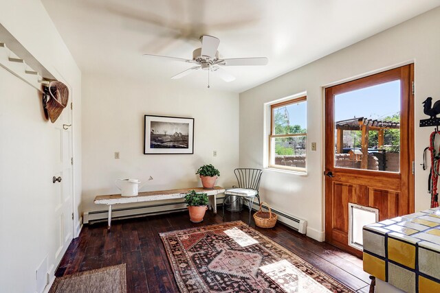 107 Rome Ln, Corrales, NM 87048 - living area with wood-type flooring, a ceiling fan, and baseboard heating